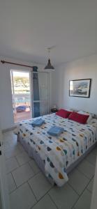 a bedroom with a bed and a large window at port de fecamp in Fécamp