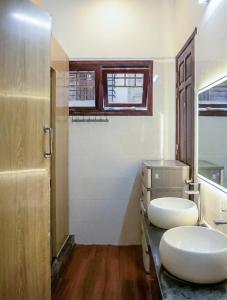 a bathroom with two white toilets on a counter at Tuna Homestay Hanoi & Experience in Hanoi +69 photos