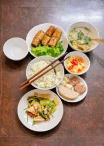 a group of plates of food on a table at Tuna Homestay Hanoi & Experience in Hanoi