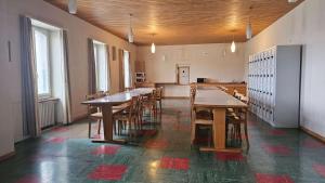 a large room with wooden tables and chairs at Marienburg Castle in Wikon
