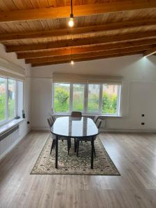 a dining room with a table and chairs at Guest house Sayak in Bokonbayevo