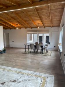 a dining room with a table and chairs at Guest house Sayak in Bokonbayevo