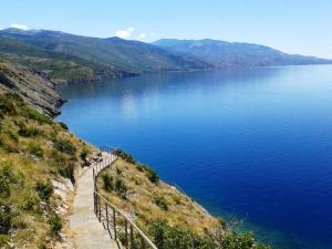 a view of a large body of water from a hill at Room Rosa in Senj
