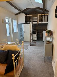 a room with two bunk beds in a room at The old surgery in Rhymney