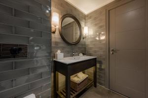 a bathroom with a sink and a mirror at Dakota Glasgow in Glasgow