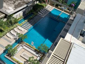 an overhead view of a swimming pool in a building at Bacolod Condo CASA LEA in Bacolod +6 photos