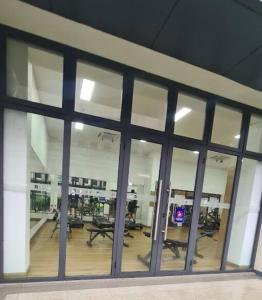 a large window in a building with a room with desks at Sky House BSD Apartment by Casanova in Cilenggang
