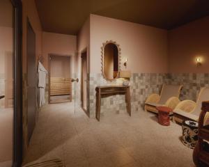a bathroom with a sink and a mirror at Scandic Charlottenburg in Berlin