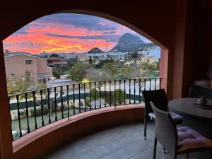 a view of a sunset from a balcony at BiBi House in Jávea