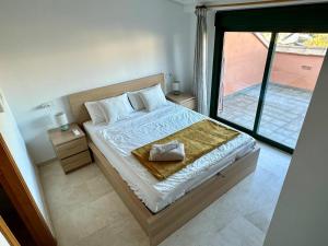 a bedroom with a bed and a large window at BiBi House in Jávea +33 photos
