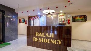 a sign for a balahuas residency in a room at Hotel Balaji Residency Dombivali in Dombivli