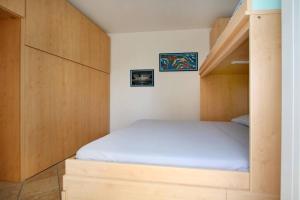 a bedroom with a bunk bed and a staircase at WI-RO Cavour, 48 - Tra Cielo e Mare in Marina di Andora