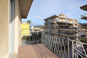 a balcony with a view of a building at WI-RO Cavour, 48 - Tra Cielo e Mare in Marina di Andora