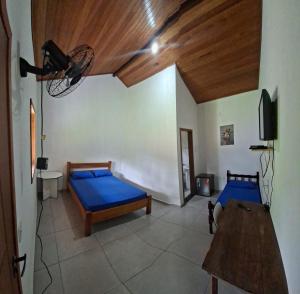 a bedroom with two beds and a wooden ceiling at Lago Camping Sana in Macaé +18 photos