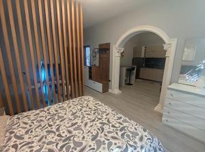 a bedroom with a bed and a dresser at My Daily Home in Fier +7 photos