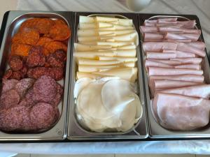 a tray of different types of meats and cheeses at Penzion Jarka in Bratislava