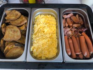 a tray filled with different types of breakfast foods at Penzion Jarka in Bratislava +24 photos