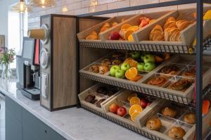 an open refrigerator filled with lots of different types of food at Best Western Leicester Oadby in Great Glen