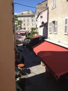 an overhead view of a street with a red awning at Casa Marina in Saint-Florent +38 photos