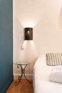a bedroom with a table next to a bed at Casa Marina in Saint-Florent