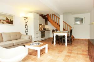 a living room with a couch and a table at Stutenhof-Wohnung-06 in Keitum