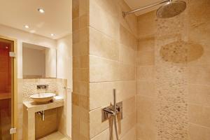 a bathroom with a sink and a shower at Listend Blick in List +16 photos