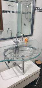 a glass sink in a bathroom with a mirror at Bracchi's room franciacorta in Cazzago San Martino