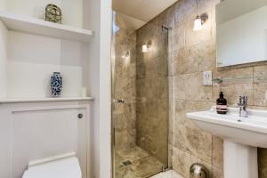 a bathroom with a shower and a sink at The Cottage in Steeple Bumpstead +17 photos