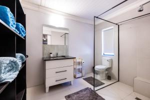 a bathroom with a sink and a toilet at Florie se Huis in Paarl +40 photos