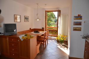 A television and/or entertainment centre at Residence Ca' Delle Margherite