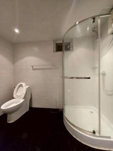 a bathroom with a glass shower and a toilet at Red House 12 in Ban Nong Pru +10 photos