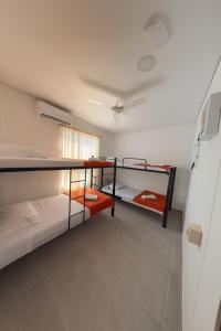 a room with two bunk beds and a ceiling at Casa Bethel 92 in Ricaurte +17 photos