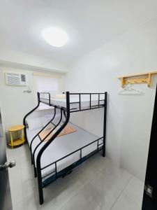 a pair of bunk beds in a room at 2BR Staycation in Deca Banilad by XTine City Scape in Banilad +9 photos