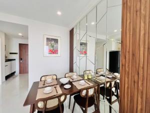 a dining room with a table and some chairs at Youyi Home in Thuan An