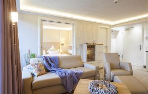 a living room with a couch and a chair at Princess in Binz