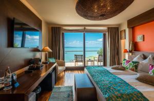 a hotel room with a bed and a view of the ocean at Mala Garden Design Hotel in Siófok +160 photos