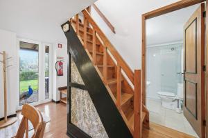 a staircase in a living room with a slide at Valle Paraizo in Camacha +136 photos