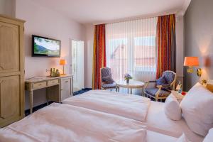 Postel nebo postele na pokoji v ubytování Hotel Krone + 37 fotografií