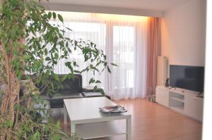 a living room with a couch and a table at Ferienwohnung Pascale in Mettlach