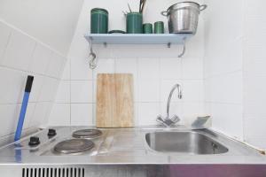 a kitchen with a sink and a counter top at CHAMPS ELYSEES STUDENT STUDIo in Rosières-près-Troyes