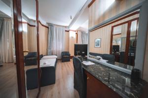 a hotel room with a bathroom with a mirror at Hotel Miro' in Rapallo +59 photos