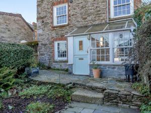 an old brick house with a blue door at 2 Bed in Polruan oc-pc033 in Fowey