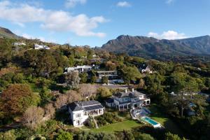 an aerial view of a mansion in the mountains at Constantia View Apartments- Luxury Self Catering in Cape Town