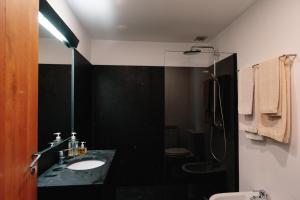 a bathroom with a sink and a toilet and a shower at Casa Agricola da Levada Eco Village in Vila Real +52 photos