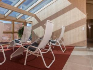 a group of chairs sitting in a room at Saunaloft Schwarzwald - privater 45qm Saunabereich - großzügige Räume mit viel Ruhe in Gemeinde Aichhalden