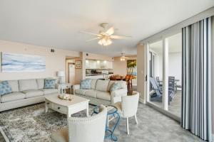 a living room with a couch and a table at SeaSpray West 303-Gulf Front in Perdido Key