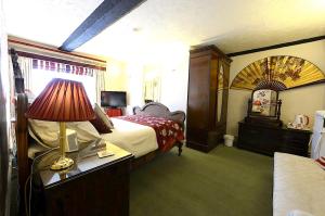 Postel nebo postele na pokoji v ubytování Meryan House Hotel