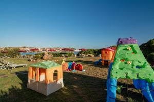 a group of play structures in a park at Club Esse Posada in Palau