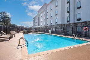 a large swimming pool in front of a building at Hampton Inn & Suites New Braunfels in New Braunfels