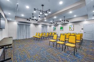 a conference room with yellow chairs and a table at Hampton Inn & Suites New Braunfels in New Braunfels +73 photos